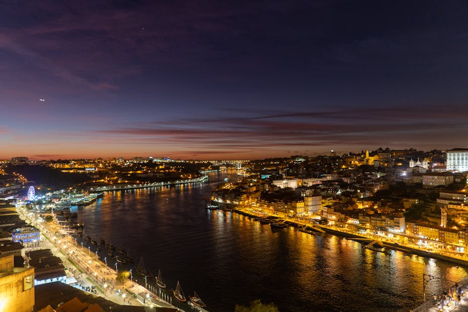 A captivating night view of Porto's illuminated riverside, highlighting the city lights.
